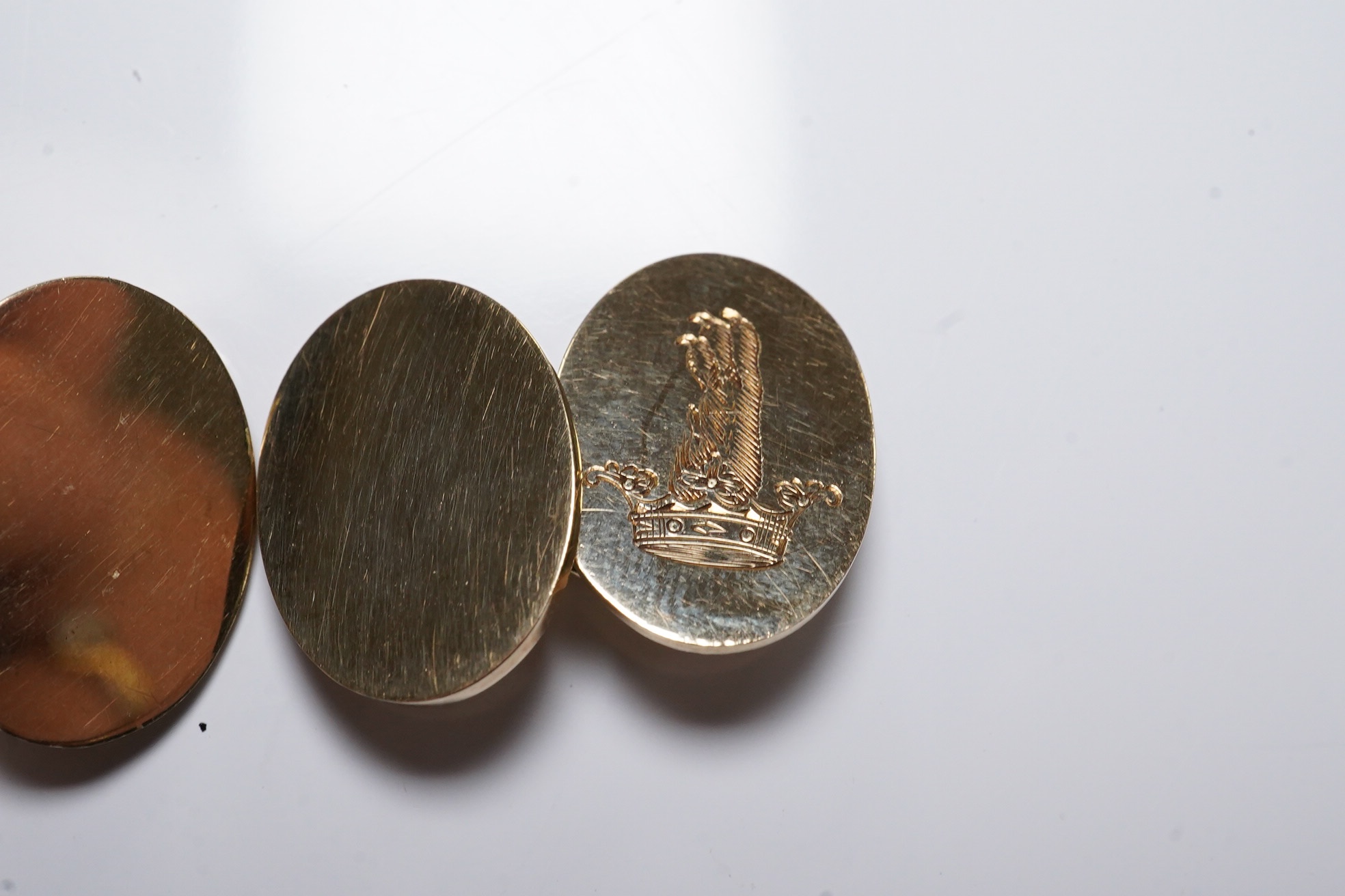 A pair of 1970's engraved 9ct gold oval cufflinks, 18mm, 11 grams. Condition - fair to good